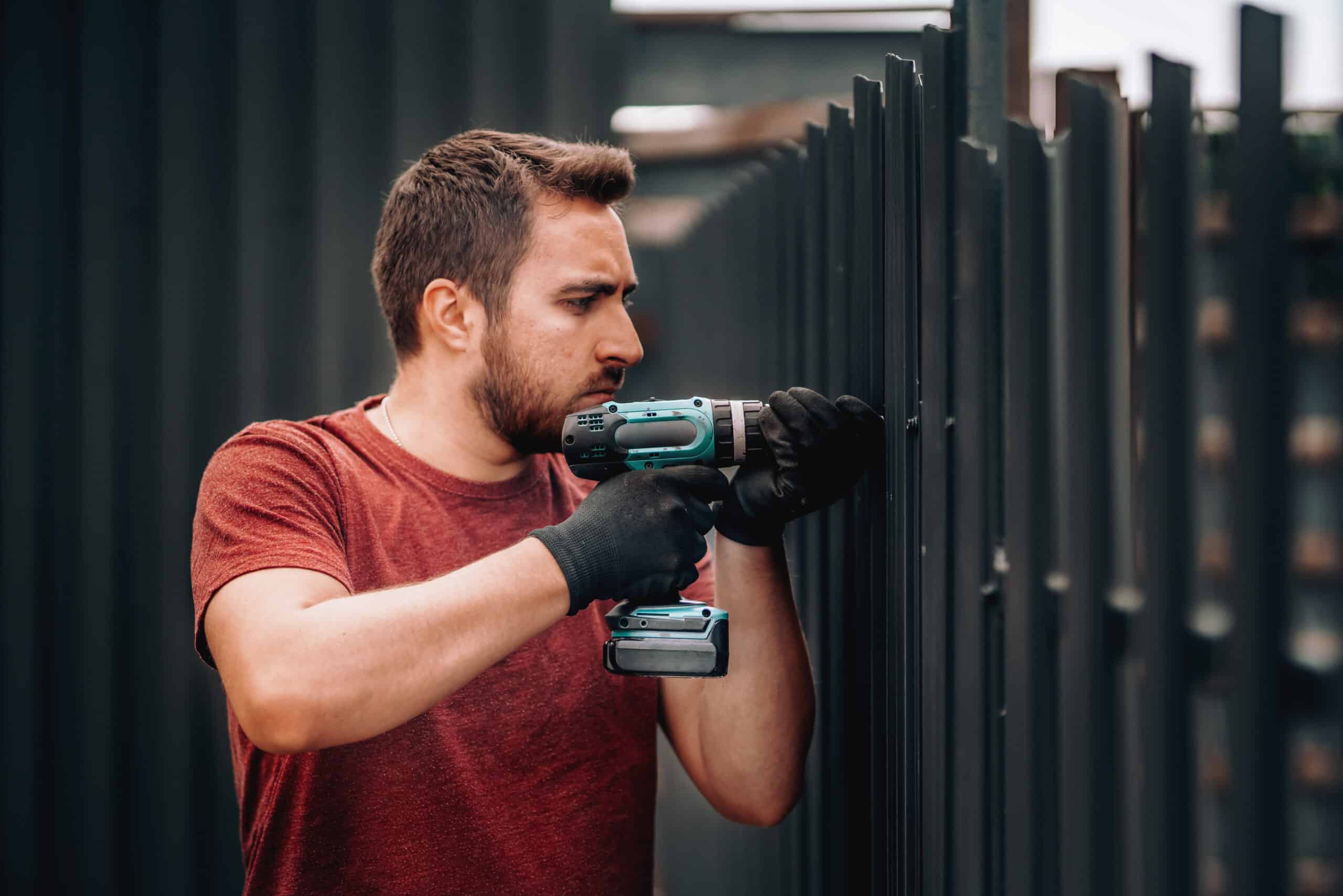 a man installing a fence
